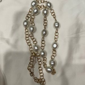 Gold and pearl long necklace.